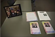  ?? ERIN EDGERTON — ASSOCIATED PRESS ?? Photos, articles and letters are laid out on display before a ceremony honoring Tessa Majors on Saturday at St. Anne’s Belfield School in Charlottes­ville, Va.