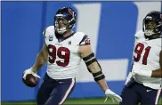  ?? ASSOCIATED PRESS FILE PHOTO ?? Former Houston Texans defensive end J.J. Watt runs into the end zone after incepting a pass against the Detroit Lions last season. Watt is heading to Arizona Cardinals.