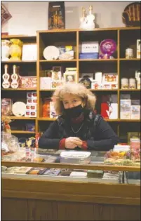  ??  ?? Franziska Schlieter poses inside her gourmet food store in Meissen. “In the Bible, God sent people plagues when they didn’t behave,” said Schlieter, who feels easing the lockdown over Christmas was a mistake. “Sometimes I have to think of that.”