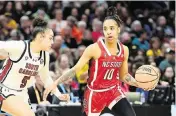  ?? KEN BLAZE USA TODAY NETWORK ?? Guard Aziaha James, seen here trying to dribble by South Carolina guard Tessa Johnson, scored 20 points for NC State but it wasn’t enough for the Wolfpack, who were in the Final Four for just the second time.