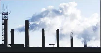  ??  ?? This file photo, shows factory chimneys near O’Hare Internatio­nal Airpoort in Chicago. On April 4, the Commerce
Department reports on US factory orders for February. (AP)