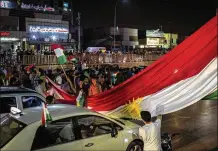  ?? IVOR PRICKETT / THE NEW YORK TIMES ?? People celebrate Monday in the streets of Irbil, Iraq, after a successful Kurdish independen­ce referendum. Iraq’s Parliament has called for troops to be sent to a disputed Kurd-held area.