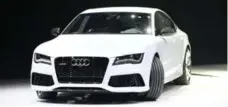  ??  ?? Audi’s RS7 gets oversized air intakes, a heavy grille and 20-inch wheels.