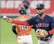  ?? Will Newton / Associated Press ?? Boston shortstop Xander Bogaerts went 3-for-4 with a two-run homer against the Orioles on Saturday.