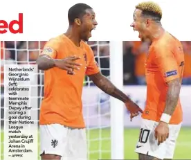  ??  ?? Netherland­s’ Georginio Wijnaldum (left) celebrates with teammate Memphis Depay after scoring a goal during their Nations League match yesterday at Johan Crujiff Arena in Amsterdam. –