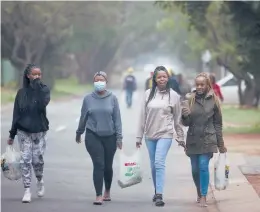  ?? DENIS FARRELL/AP ?? Students at Tshwane University of Technology, which has emerged as a hot spot in Pretoria, South Africa. The variant has fueled a surge of COVID-19 cases in the nation.