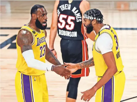  ?? KIM KLEMENT/ USA TODAY SPORTS ?? Anthony Davis ( 3) says of his dynamic with LeBron James: “When we watch film or even during the course of a game, if I did something wrong, he tells me. If he does something wrong, I tell him. That’s what makes it work.”