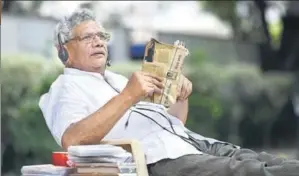  ?? ARVIND YADAV / HT ?? When he gets time, Yechury puts on his headphones to listen to Shamshad Begum songs