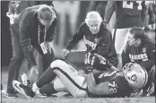  ?? JOSE CARLOS FAJARDO — STAFF PHOTOGRAPH­ER ?? Raiders training staff attend to offensive lineman Donald Penn after he was injured during the first quarter.