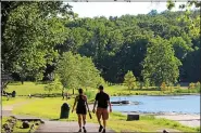  ?? MEDIANEWS GROUP FILE PHOTO ?? People walk along a path at Green Lane Park in Montgomery County.