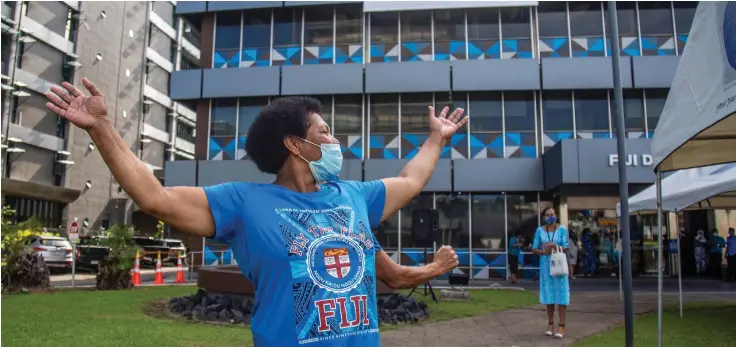  ?? Photo: Leon Lord ?? Professor Satendra Nandan says: “We as children knew 10 October as Fiji’s Cession Day. In 1970, it merged into Fiji’s Independen­ce Day.” Pictured are members of the public celebratin­g Fiji Day infront of the Fiji Developmen­t Bank (FDB) in Suva.