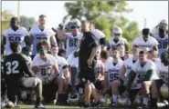  ?? ROD AYDELOTTE — WACO TRIBUNE-HERALD VIA AP, FILE ?? In this file photo, Baylor head football coach Matt Rhule, center, gathers his team in the center of the field following the first day of NCAA college football practice in Waco, Texas.