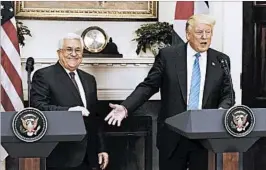  ?? OLIVIER DOULIERY/GETTY ?? President Donald Trump and the White House went out of their way to build up Palestinia­n Authority President Mahmoud Abbas, left, during his Wednesday visit with Trump.