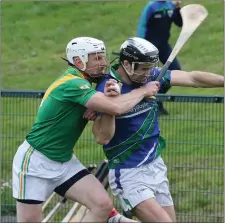  ??  ?? Brendan Doyle (Glynn-Barntown) is challenged by Barry Kenny.