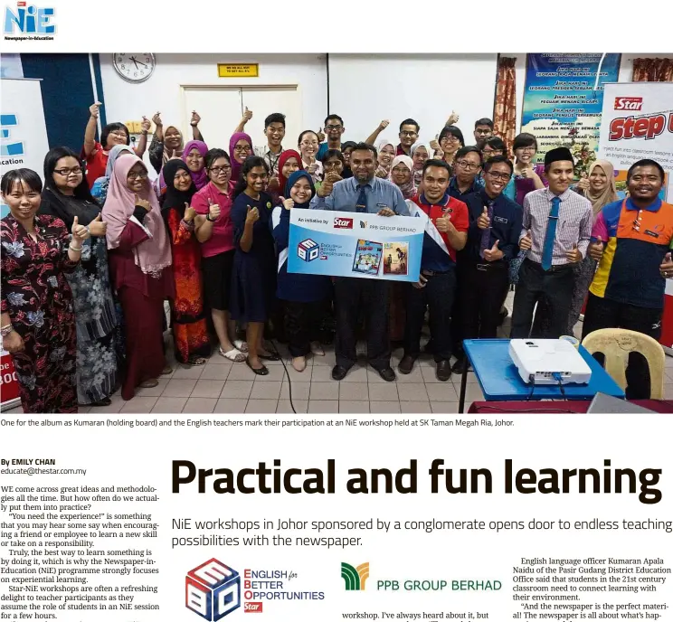  ??  ?? One for the album as Kumaran (holding board) and the English teachers mark their participat­ion at an NiE workshop held at SK Taman Megah Ria, Johor. By EMILY CHAN educate@thestar.com.my