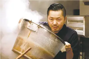  ??  ?? Crafting the perfect bowl of heaven: Chef Osamu Tomita