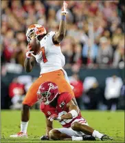  ?? TOM PENNINGTON / GETTY IMAGES ?? Clemson and Mike Williams (7) got the best of Alabama in last year’s national title game. The teams meet again this year in the semifinals.