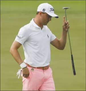  ?? The Associated Press ?? GOING LOW: Justin Thomas reacts after his birdie on No. 17 as he ties the major-tournament record of 63 in the U.S. Open Saturday at Wisconsin’s Erin Hills. Despite playing the round in 9 under par, Thomas finished the day one stroke behind Brian...