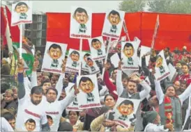  ??  ?? Samajwadi Party workers celebrate after Uttar Pradesh chief minister Akhilesh Yadav was unanimousl­y elected the party’s national president in Lucknow on Sunday. PTI PHOTO