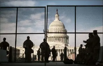  ?? T.J. Kirkpatric­k/The New York Times ?? National Guard troops are stationed at the Capitol in Washington. Investigat­ions are underway into the extent Capitol Police and far-right lawmakers were involved in last week’s mob attack.