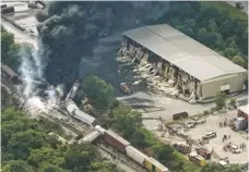  ?? PATRICK SEMANSKY, AP An explosion triggered by the crash of the freight train with a trash truck damaged buildings in a White Marsh industrial park. ??