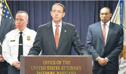  ?? KEVIN RICHARDSON/BALTIMORE SUN ?? Maryland U.S. Attorney Rod J. Rosenstein, joined by Baltimore Police Commission­er Kevin Davis and Baltimore FBI field office head Gordon B. Johnson, announces federal racketeeri­ng charges against seven Baltimore police officers.