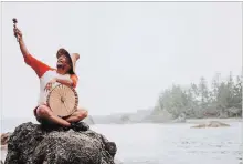  ?? CHRIS THORN PHOTOGRAPH­Y THE CANADIAN PRESS ?? The roughly three-hour tour offers more than a history lesson about the site. Guides like Robert Dennis Junior (Wiisqi), shown holding a drum, tell stories reflecting the beliefs and traditions of the Huu-ay-aht people.