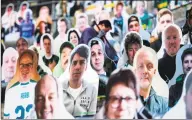  ?? Ina Fassbender / AFP via Getty Images ?? Cardboard cutouts with portraits of Borussia Moenchengl­adbach's supporters are seen at the Borussia Park football stadium in Germany, amid the novel coronaviru­s pandemic.