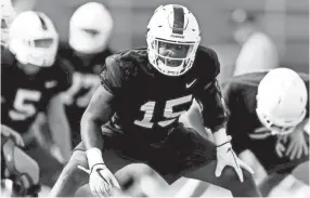  ?? CALVIN MATTHEIS, KNOXVILLE NEWS SENTINEL ?? Tennessee wide receiver Jauan Jennings (15) stretches during practice last years.