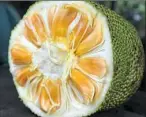  ?? Getty Images ?? The spiky-skinned jackfruit has sweet bulbs of fruit inside. For local menus that feature jackfruit, see Page C-2.