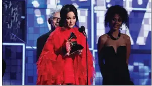  ?? AP/Invision/MATT SAYLES ?? Kacey Musgraves accepts the award for album of the year Sunday at the 61st annual Grammy Awards in Los Angeles. The award was the fourth of the night for Musgraves, who took Grammys in three country-music categories.