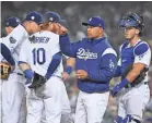  ?? JAYNE KAMIN-ONCEA/USA TODAY SPORTS ?? Dodgers manager Dave Roberts will have one less chance to visit the mound during a game starting this year.