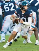  ?? MIKE CAUDILL/AP ?? Virginia quarterbac­k Anthony Colandrea runs out of the pocket to avoid the Duke defense during the first half of Saturday’s game in Charlottes­ville, Va.