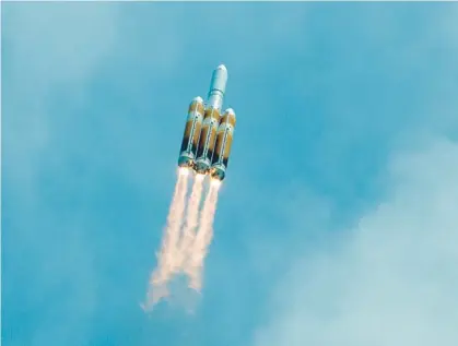  ?? JOHN RAOUX/AP ?? A United Launch Alliance Delta IV Heavy rocket carrying classified spy satellite cargo for the U.S. National Reconnaiss­ance Office lifts off from Space Launch Complex 37B at the Cape Canaveral Space Force Station on Tuesday in Cape Canaveral.