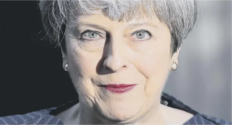  ??  ?? 0 Theresa May stands outside 10 Downing Street after calling for an early general election on 8 June. She says the vote is a chance for people to speak out against the ‘tunnel vision’ of the Nationalis­ts