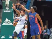  ?? JEFF HANISCH / USA TODAY SPORTS ?? Bucks guard Matthew Dellavedov­a passes the ball behind his back Friday night against the Pistons.