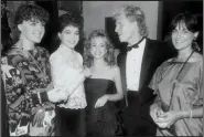  ?? (Special to the Democrat-Gazette) ?? For their second date, in the fall of 1987, Lisa Gibson took Kris Fischer to a fundraiser at the Villa Marre, featured in the popular TV sitcom “Designing Women.” Kris gazed adoringly at Lisa as they posed for a photo at the event with Martha Snyderman (far left), Debbie Wright (center) and Nancy Snyderman (far right). Kris and Lisa were married on Jan. 29, 1988.