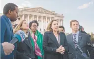  ?? Tasos Katopodis, Getty Images ?? U.S. Rep. Katie Hill, D-Calif., speaks outside the U.S. Capitol in Washington on Jan. 15 with members of Congress’ freshman class.