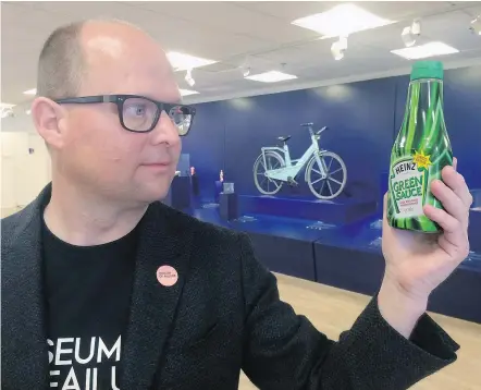  ?? — PHOTOS: THE ASSOCIATED PRESS ?? Samuel West, curator of the Museum of Failure, poses with a bottle of Heinz Green Sauce tomato ketchup at the Museum of Failure in Helsingbor­g, Sweden.