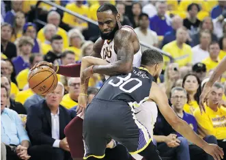  ?? EZRA SHAW/GETTY IMAGES ?? Steph Curry and the Golden State Warriors couldn’t completely stop LeBron James but they did slow the Cleveland Cavaliers star down enough for a Game 2 victory on Sunday.