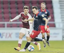  ??  ?? Josh Scowen in action against Northampto­n Town.