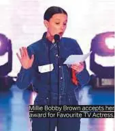  ??  ?? Millie Bobby Brown accepts her award for Favourite TV Actress.
