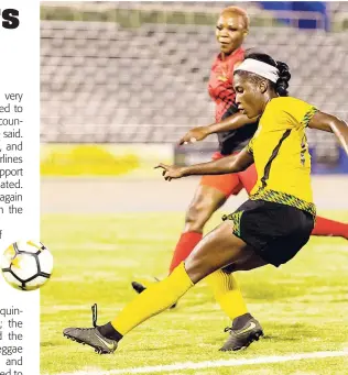  ??  ?? Jamaica’s Deneisha Blackwood (front) shoots as on Antigua and Barbuda’s player looks on during their Concacaf Caribbean Women’s Qualifier at the National Stadium in Kingston on Saturday, August 25, 2018.