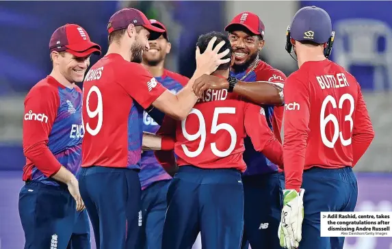  ?? Alex Davidson/Getty Images ?? > Adil Rashid, centre, takes the congratula­tions after dismissing Andre Russell