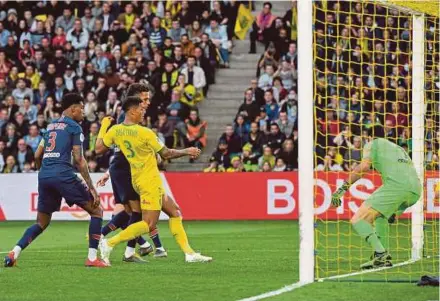  ?? AFP PIC ?? Nantes’ Diego Carlos (centre) scores against Paris Saint-German in a Ligue 1 match at La Beaujoire Stadium in Nantes on Wednesday.