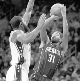  ?? LAURENCE KESTERSON/ASSOCIATED PRESS ?? Magic swingman Terrence Ross, right, says the team has to get tougher as a unit. “This is a league for grown men. We’ve got to show up every night,” he said.