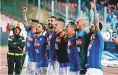  ?? Reuters ?? Napoli’s Marek Hamsik and teammates celebrate after the 4-2 win over Udinese at the Stadio San Paolo, Naples, Italy on Wednesday. Napoli clash with Juventus on Sunday.