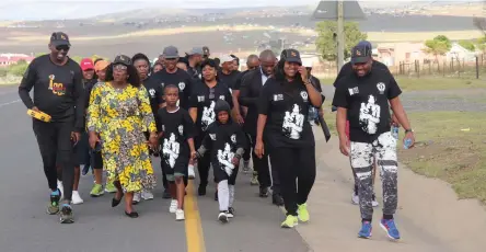 ?? Picture: SUPPLIED ?? IN THE STEPS OF GREATNESS: Department of sport, recreation, arts &amp; culture MEC Bulelwa Tunyiswa leads the walk of remembranc­e from Nelson Mandela’s Qunu residence to the Nelson Mandela Museum. The walk was followed by the main event which included a dialogue at the Nelson Mandela Museum Bhunga building in town.