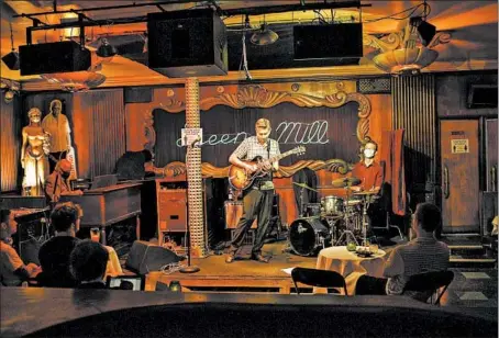  ?? ARMANDO L. SANCHEZ/CHICAGO TRIBUNE ?? Chris Foreman, from left, Joel Paterson and Alex Hall perform at the Green Mill on June 28 in Chicago.