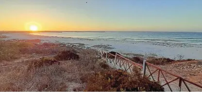  ?? /Pictures: Nick Yell ?? Sundowner calling: The beach is an ideal place to toast a successful road trip to Lamberts Bay.